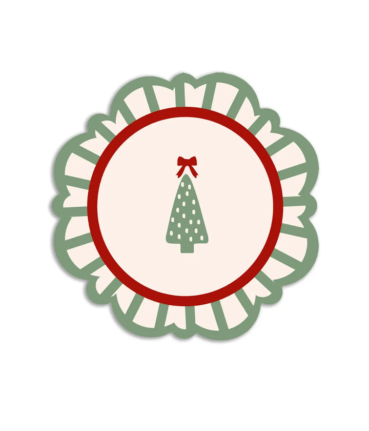 Una tovaglietta con pino e fiocco rosso sulla punta. Decorazione bordo verde e  bianco. Sfondo bianco