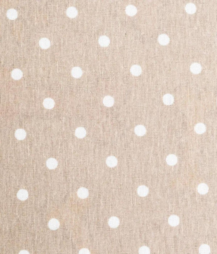 Texture beige con pois bianchi di cuccia per cane