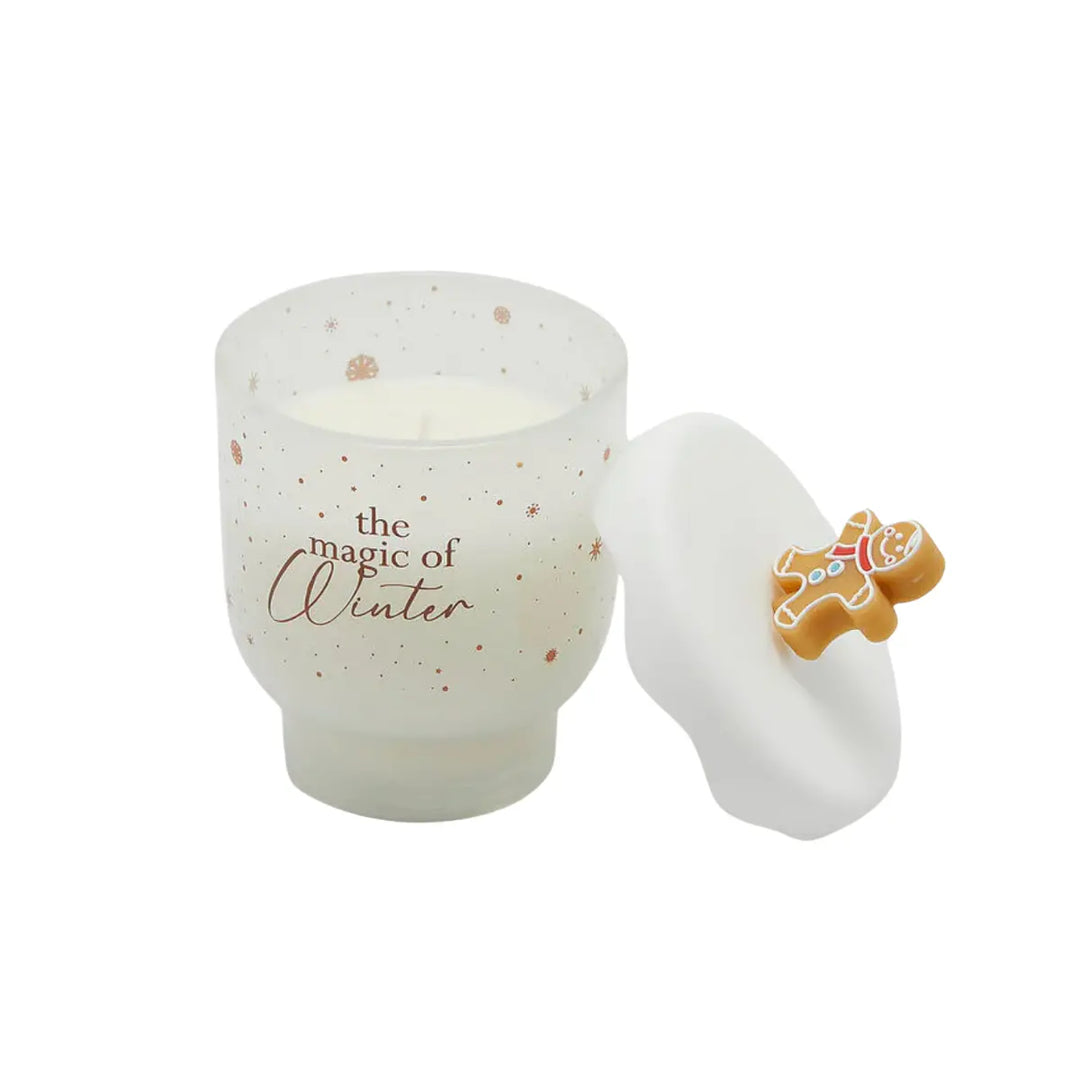 Candela bianca natalizia con biscotto di marzapane sul tappo