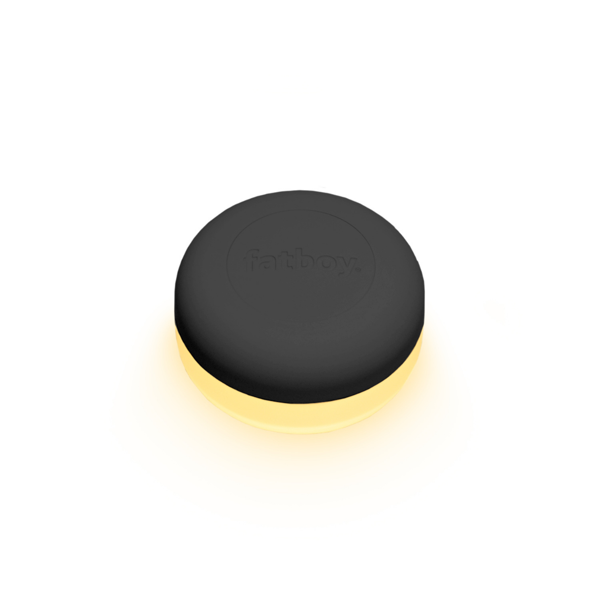 Luce ricaricabile accesa. Parte sopra nera, sotto trasparente. Luce bianca. Sfondo bianco