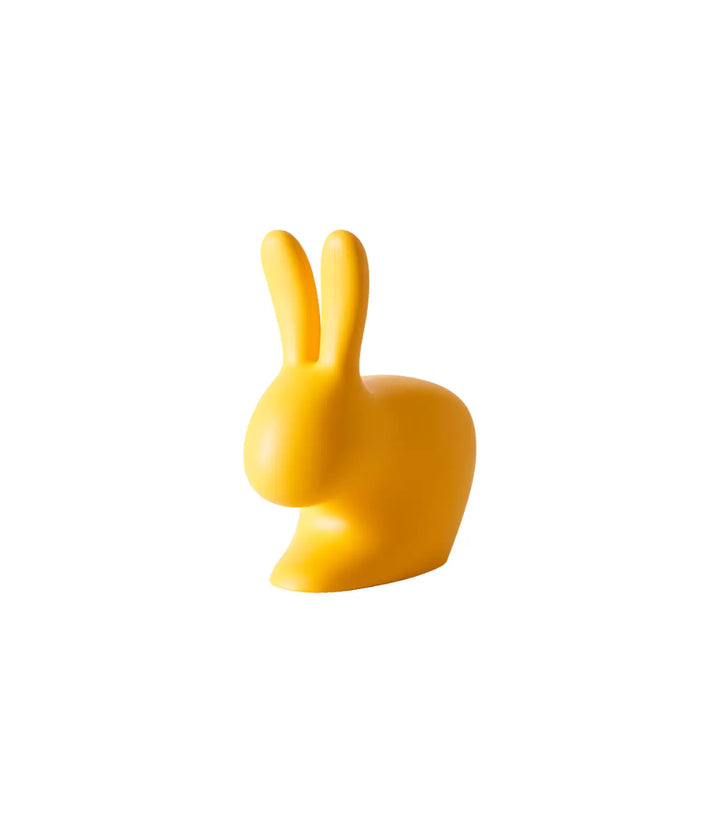 Fermaporta o fermalibro giallo a forma di coniglio. Immagine su sfondo bianco