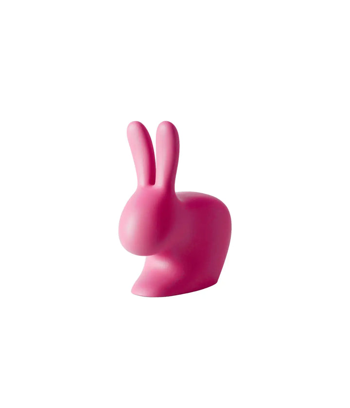 Fermoporta o fermalibro rosa a forma di coniglio. Immagine su sfondo bianco