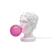 La lampada Grace di Seletti che rappresenta una dea che fa l'occhiolino e una bolla con la chewing gum