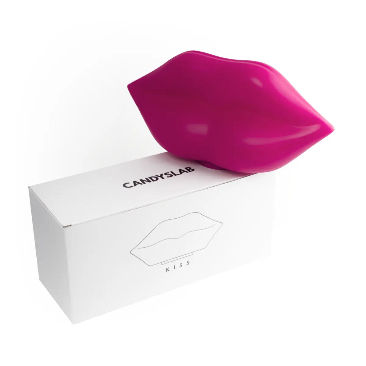 Lampada da tavolo fucsia a forma di labbra. Confezione bianca con scritte nere. Sfondo bianco