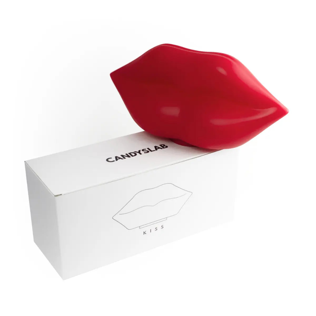Lampada da tavolo rossa a forma di labbra. Confezione bianca con scritte nere. Sfondo bianco