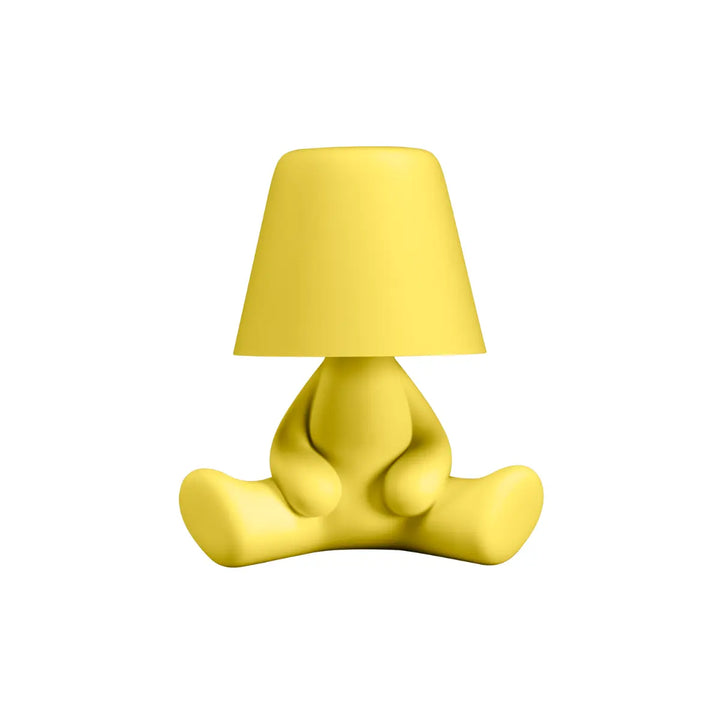 Lampada gialla con struttura a forma di personaggio seduto con la testa a forma di paralume