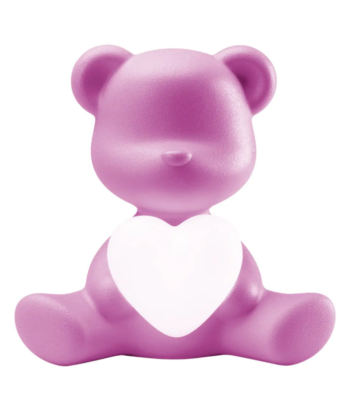 Lampada a forma di orsetto fuxia con cuore che s'illumina al centro di Qeeboo