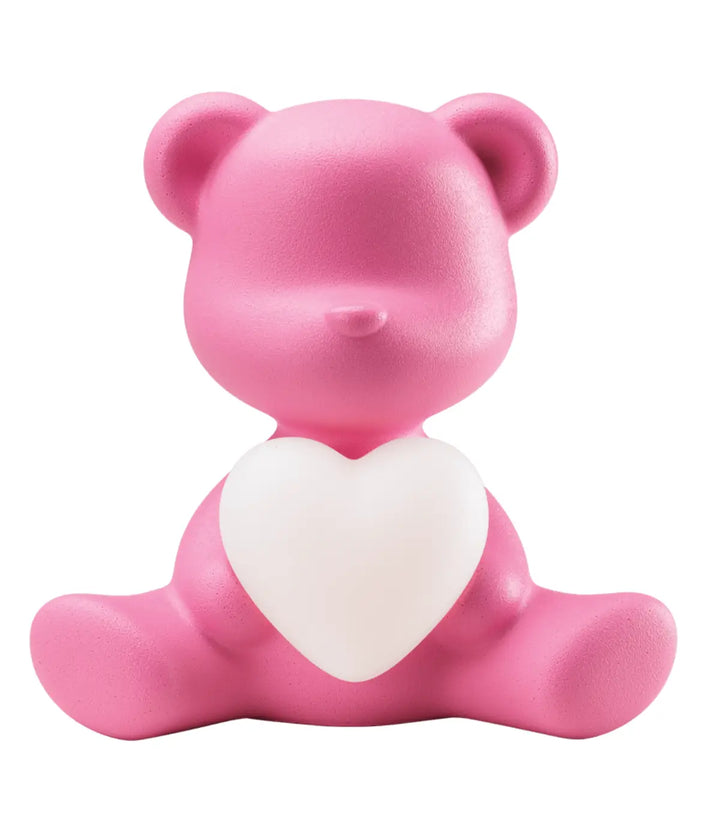 Lampada a forma di orsetto rosa con cuore che s'illumina al centro di Qeeboo