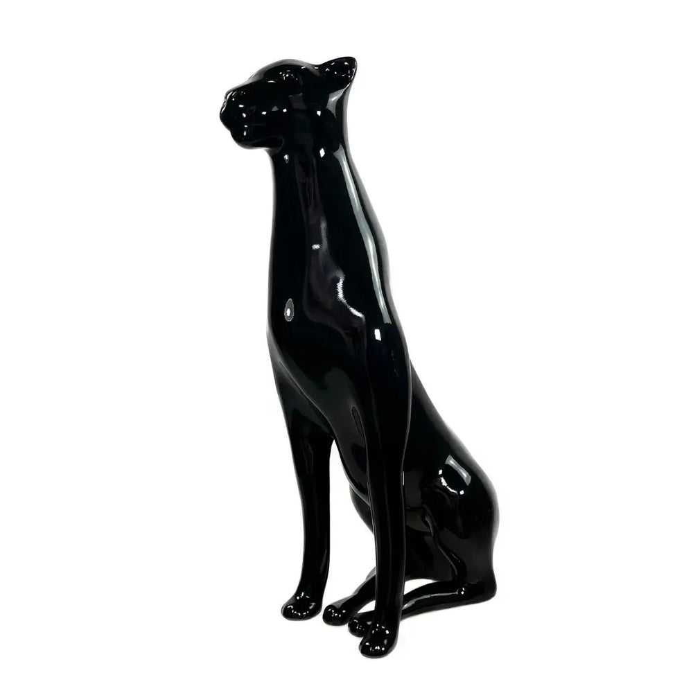 Lato Fronte statua nero a forma di pantera, con occhi naso bocca e zampe. Sfondo bianco