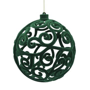 Pallina di Natale in velluto di colore verde con una fantasia arabesche 