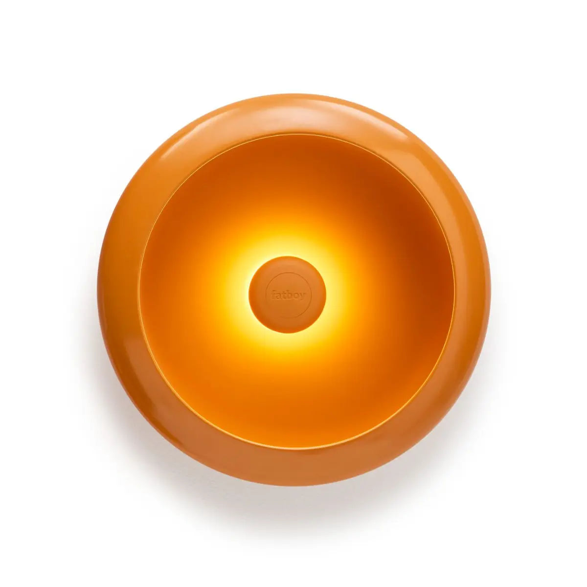 Lampada da tavolo/vuotatsche rotonda arancione con luce accesa al centro. Sfondo bianco