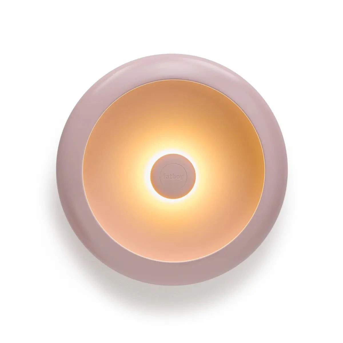 Lampada da tavolo/ svuotatsche rotonda rosa chiaro con luce accesa al centro. Sfondo bianco