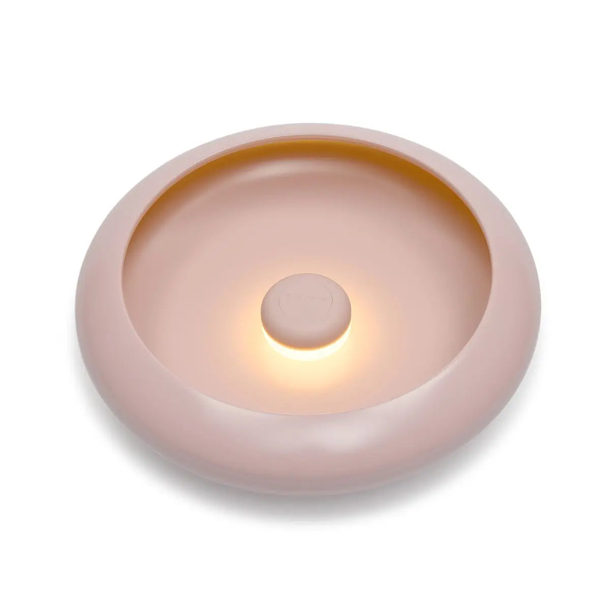 Lampada da tavolo/ svuotatsche rotonda rosa chiaro con luce accesa al centro. Sfondo bianco