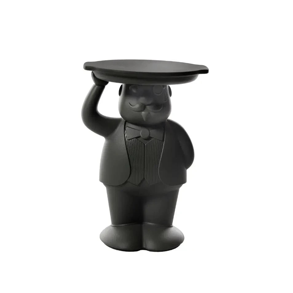 Tavolino nero che rappresenta un maggiordomo con un braccio alzato che sostiene un vassoio che funge da appoggio del tavolino. Sfondo bianco