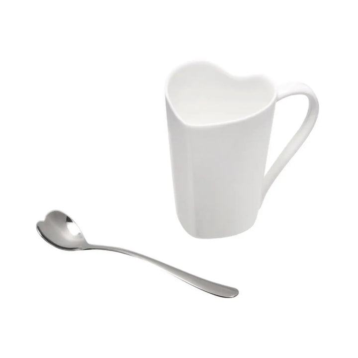Set da tè con tazzina in ceramica bianca a forma di cuore e cucchiaio in acciaio coordinato