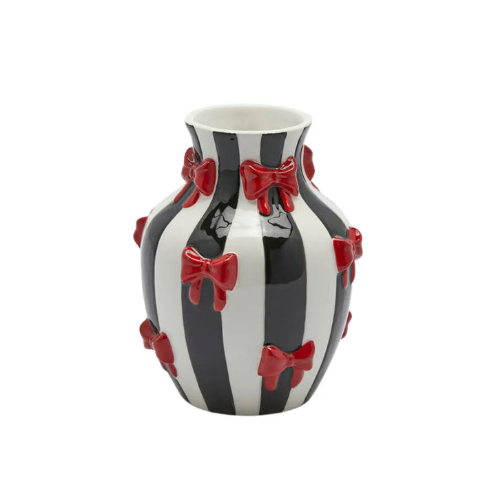 Vaso a righe bianche e nero con fiocchi rossi per fiori 